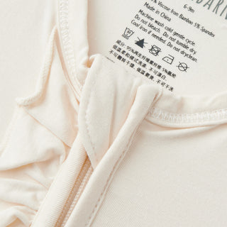 Salt Luxe Solid Ruffle Footed Romper